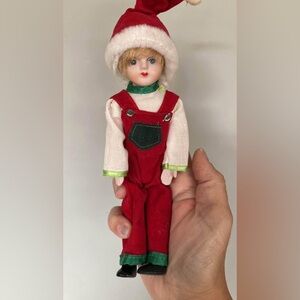 Vintagew Christmas Porcelain 8inch doll dressed in Holiday Colours